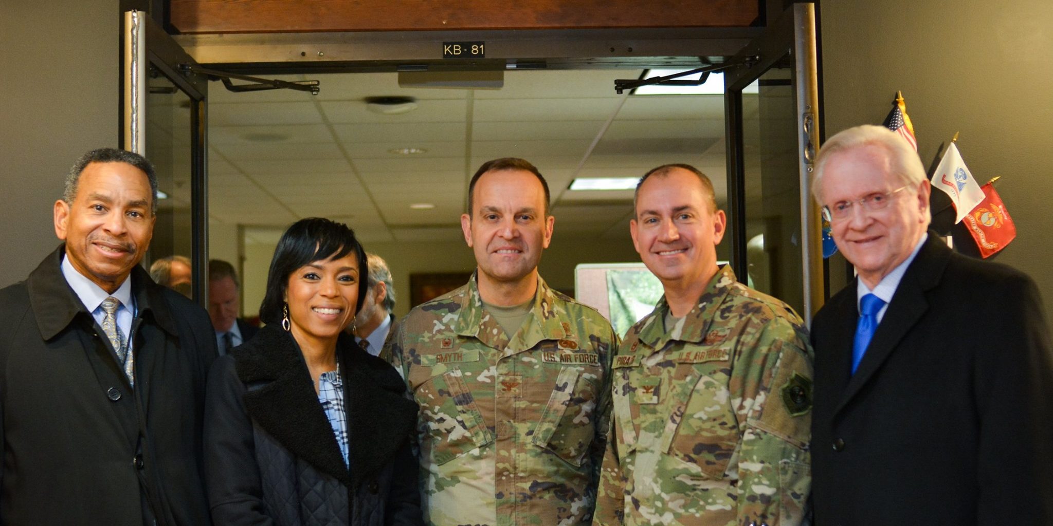 County Executive Angela Alsobrooks (Second from left) is joined by Roundtable President/CEO M.H. Jim Estepp (Right), Joint Base Andrews Commander Col. Andrew Purath (Second from right), County CAO Major Riddick (Left) and Col. Smyth (Center)  outside of the Roundtable's Maryland Room at the Aeromedical Staging Facility on Joint Base Andrews.